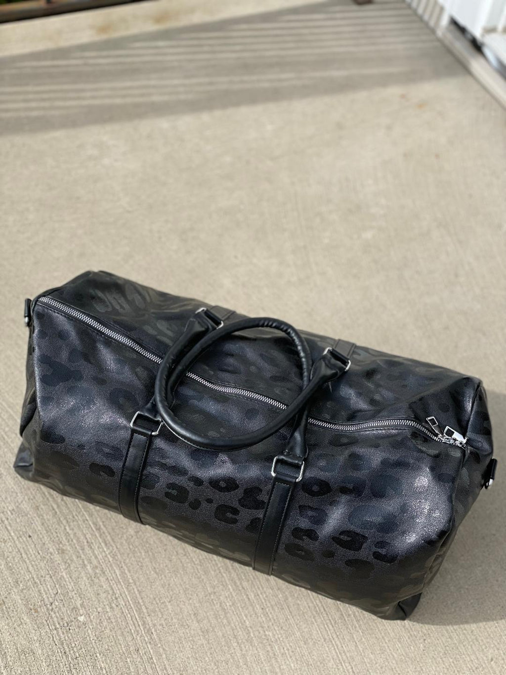 THE LEOPARD DUFFLE BAG